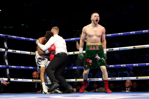 Zak Chelli celebrates his tenth-round stoppage of David Morrell